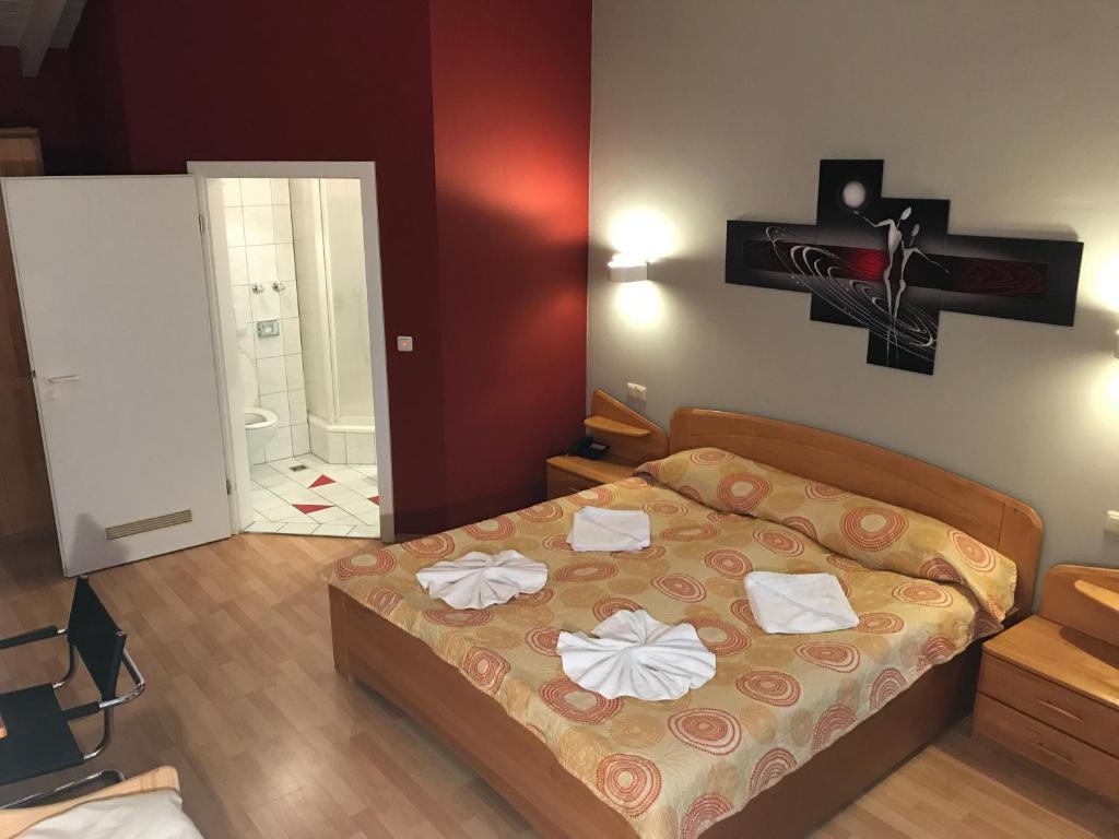 Postel nebo postele na pokoji v ubytování Hotel Korfu