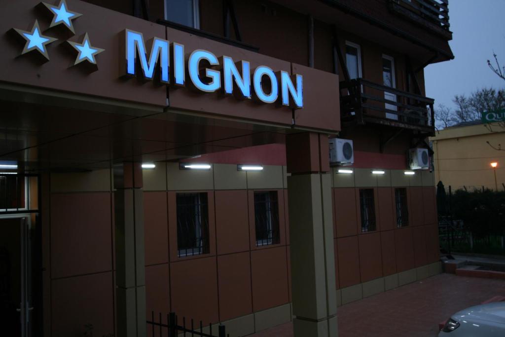 a mision sign on the side of a building at Hotel-Hostel Mignon Mamaia -private rooms with free parking in Mamaia