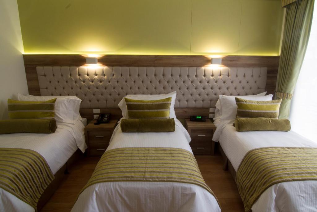 Postel nebo postele na pokoji v ubytování De Película Hotel