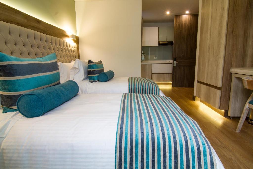 Postel nebo postele na pokoji v ubytování De Película Hotel
