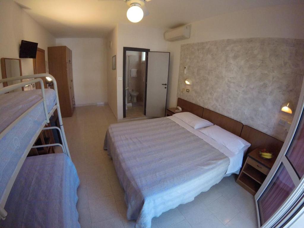 Postel nebo postele na pokoji v ubytování Hotel Samoa