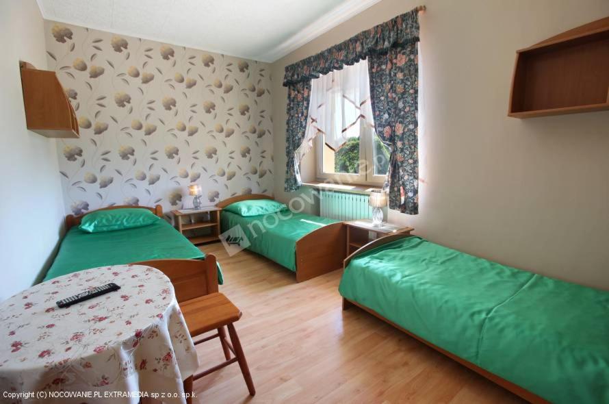 Posteľ alebo postele v izbe v ubytovaní Pokoje Adriano