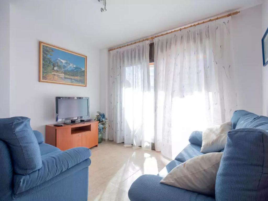 Televízia a/alebo spoločenská miestnosť v ubytovaní Mirablau