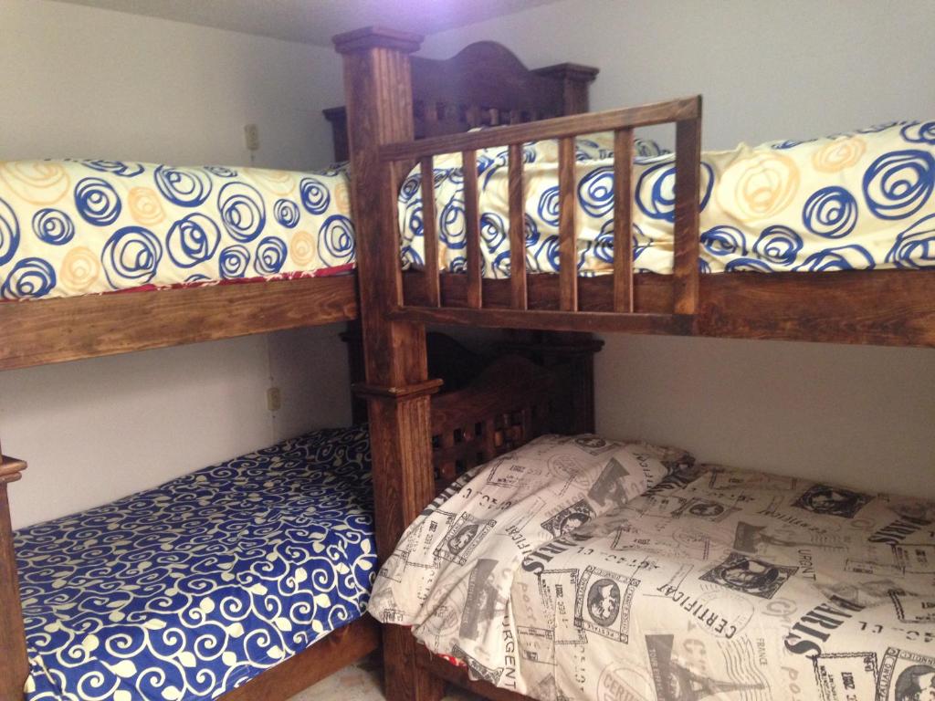Postel nebo postele na pokoji v ubytování Hostal Makea Pachuca