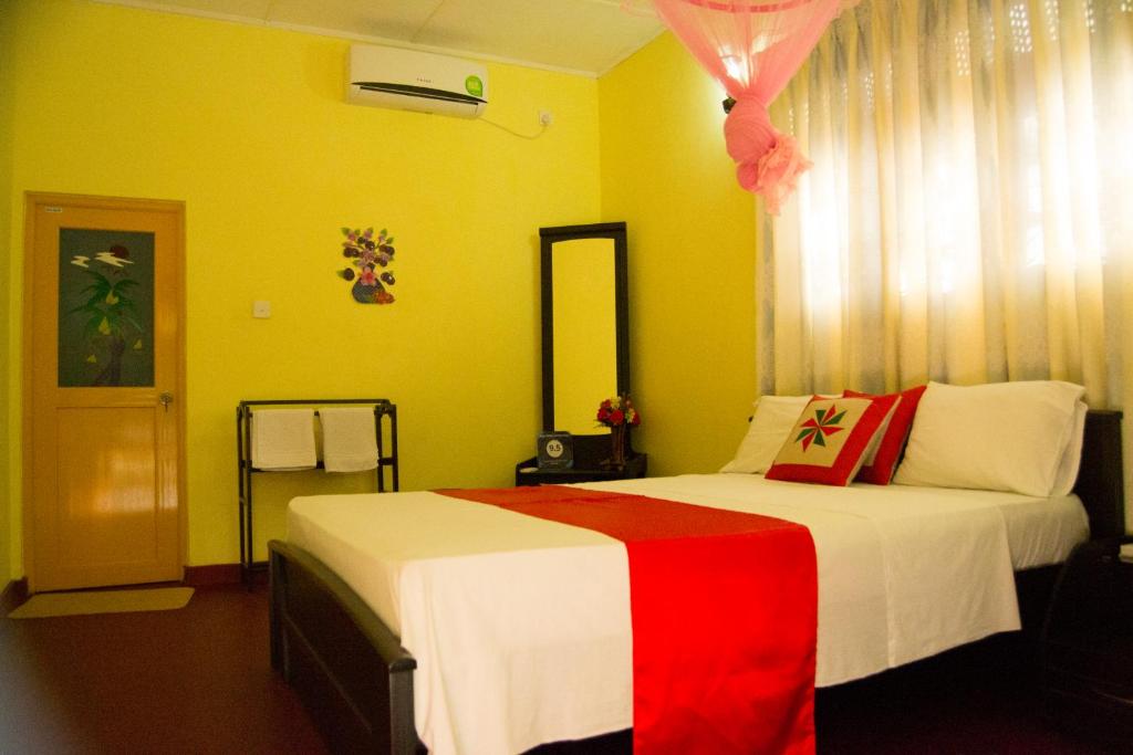 Postel nebo postele na pokoji v ubytování Sigiri Sithru Home Stay