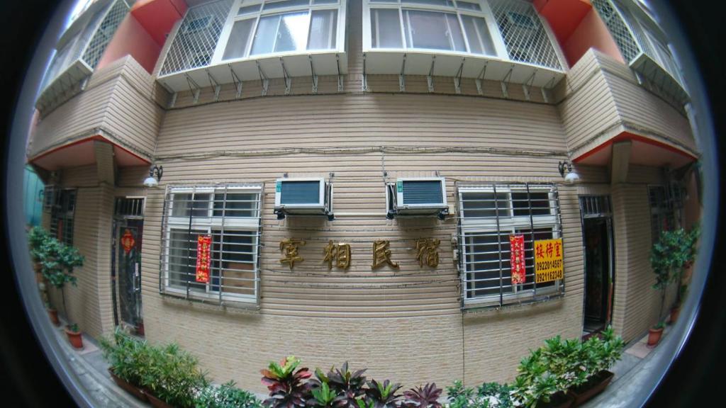 a reflection of a building in a porthole at ZaiXiang in Tamsui