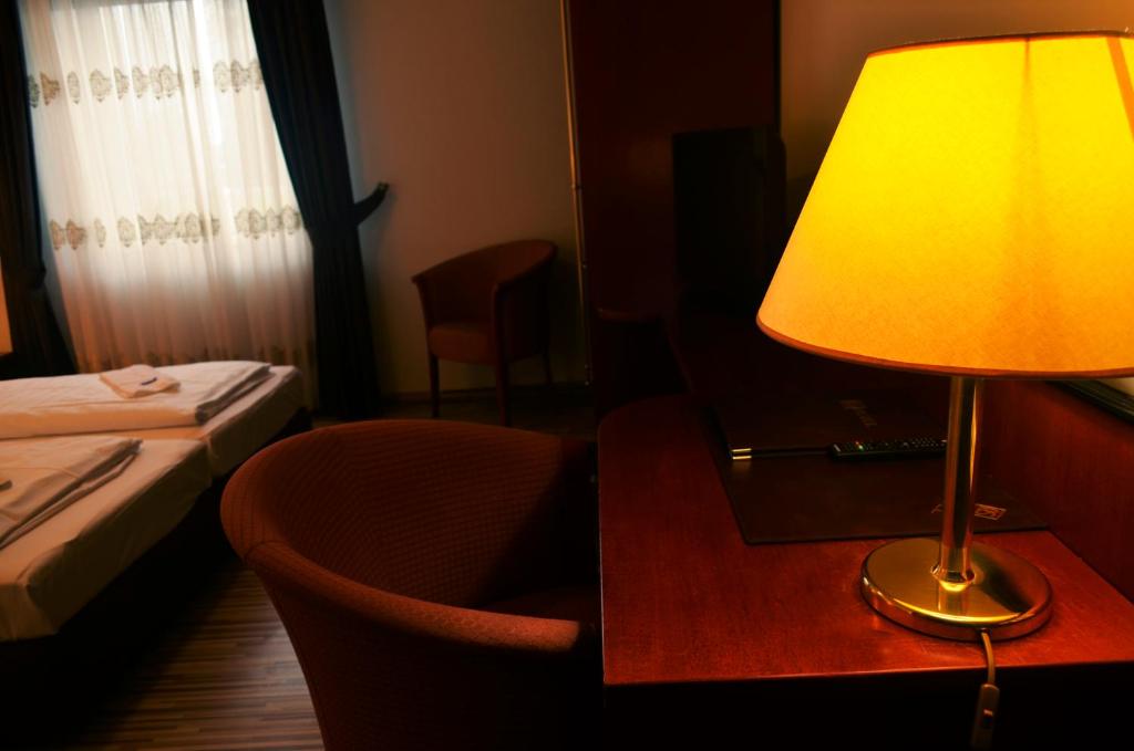 Postel nebo postele na pokoji v ubytování AS Hotel