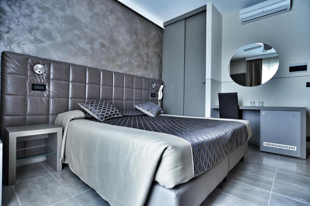 Postel nebo postele na pokoji v ubytování Hotel Sorriso