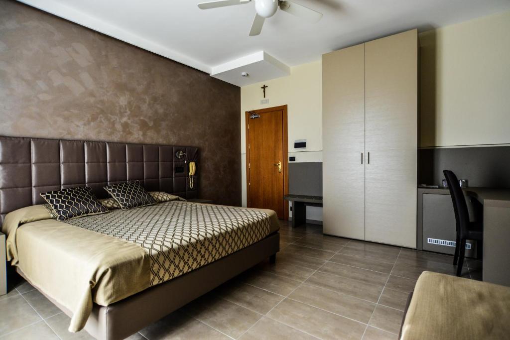Postel nebo postele na pokoji v ubytování Hotel Sorriso