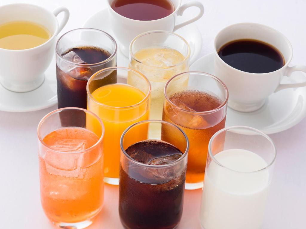 a group of different types of drinks and cups of coffee at Hotel Route-Inn Tokyo Ikebukuro in Tokyo