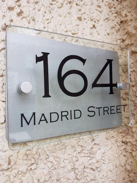 a sign on a wall that reads madrid street at Titanic History Private Home in Belfast
