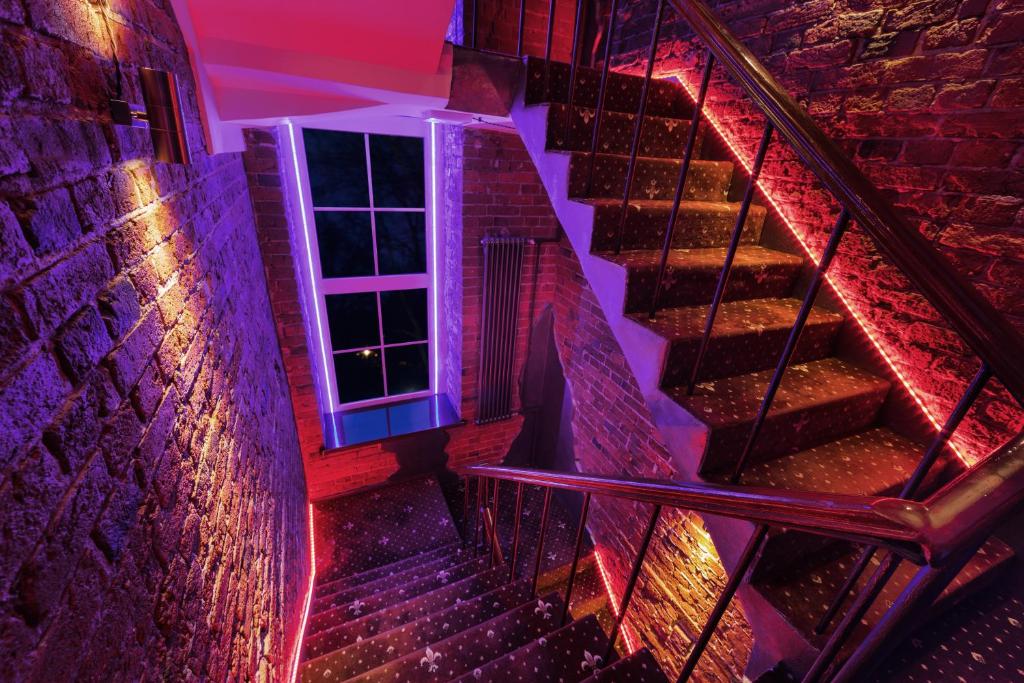 a set of stairs with a window and lights at Hotel Kirpich in Moscow