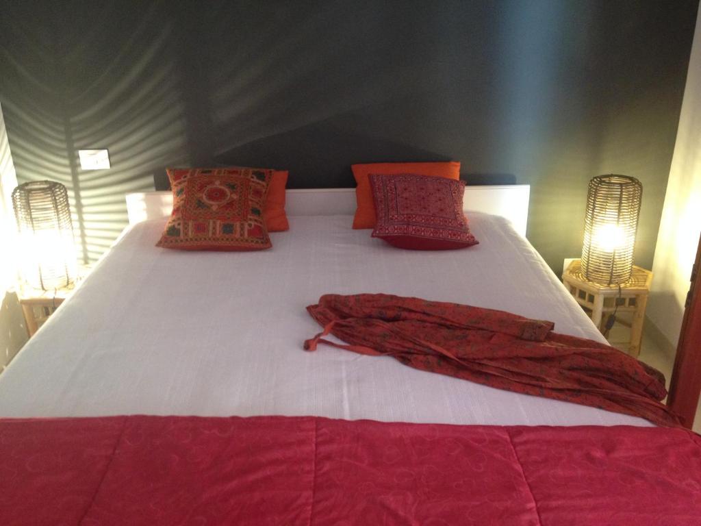En eller flere senge i et værelse på Casa Dellestate