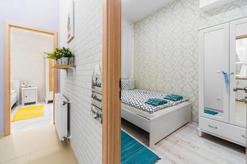 Posteľ alebo postele v izbe v ubytovaní Dominika Apartment