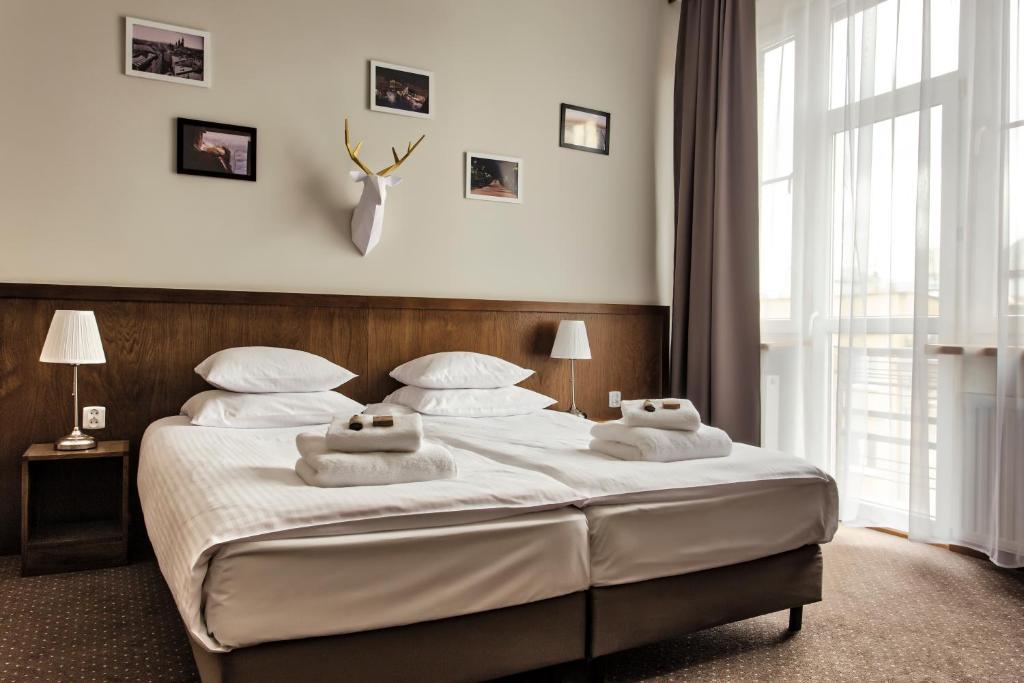 Posteľ alebo postele v izbe v ubytovaní Daniel Griffin Aparthotel by Artery Hotels