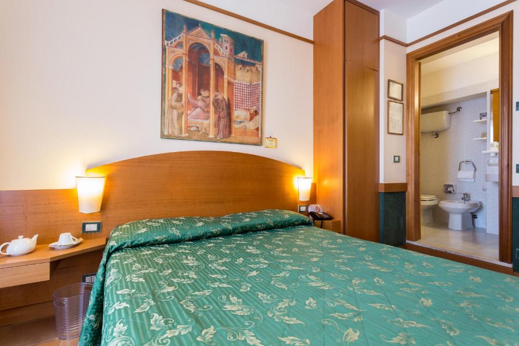 Postel nebo postele na pokoji v ubytování Hotel La Terrazza RESTAURANT & SPA
