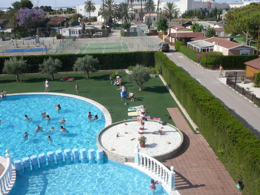 a group of people in a swimming pool at Camping San Javier in San Javier