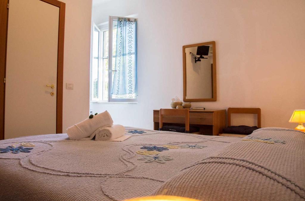 Postel nebo postele na pokoji v ubytování Hotel Silvia Framura - Cinque Terre