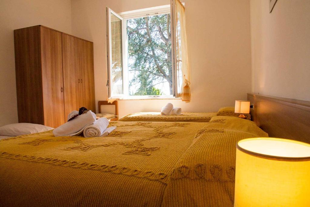 Postel nebo postele na pokoji v ubytování Hotel Silvia Framura - Cinque Terre