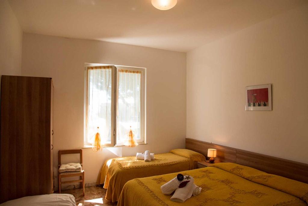 Postel nebo postele na pokoji v ubytování Hotel Silvia Framura - Cinque Terre