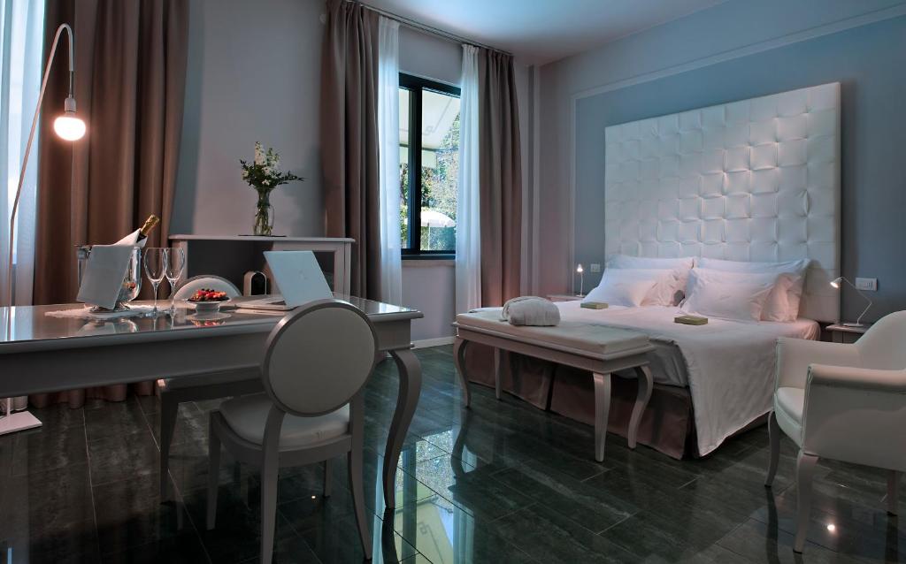 Postel nebo postele na pokoji v ubytování Palace Hotel San Pietro