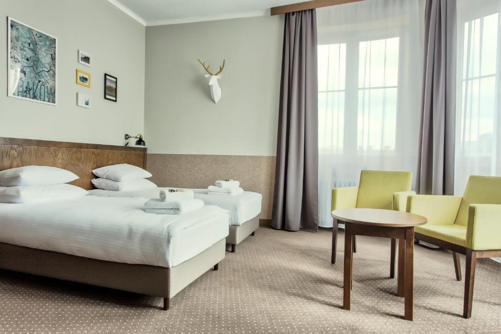 Posteľ alebo postele v izbe v ubytovaní Daniel Griffin Aparthotel by Artery Hotels