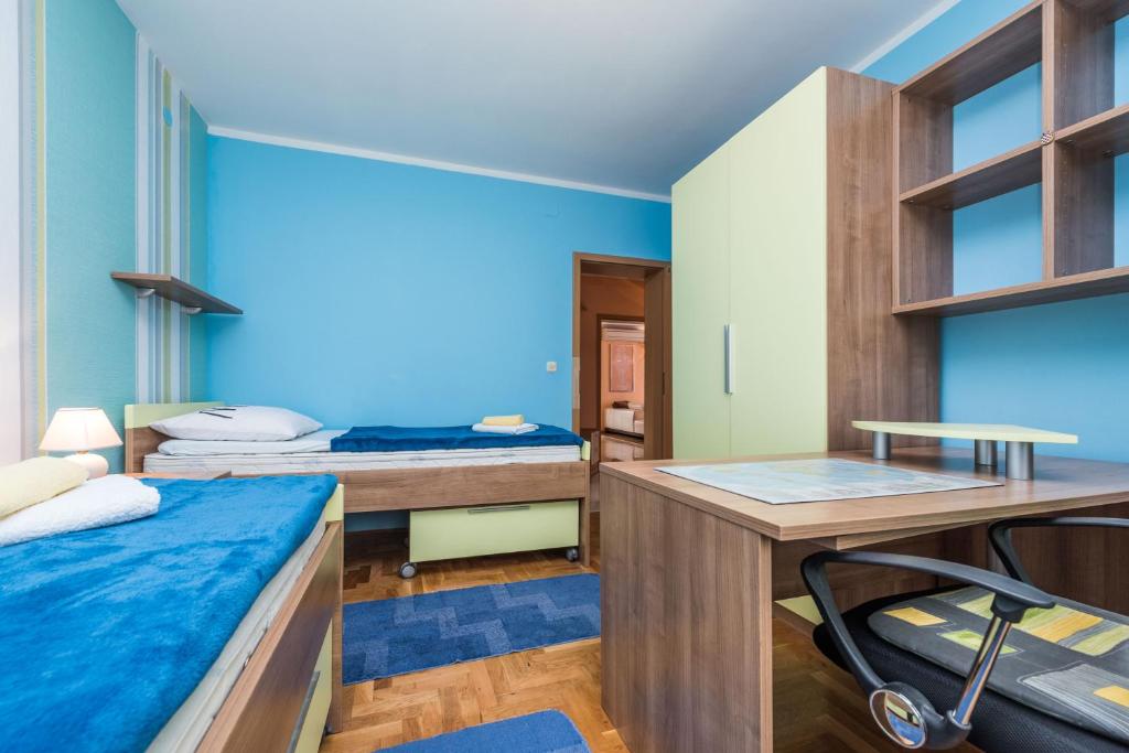 Łóżko lub łóżka w pokoju w obiekcie Kristina Apartments