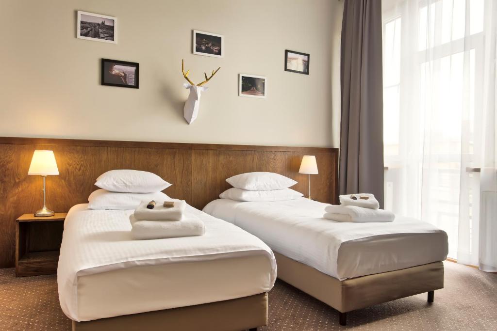 Posteľ alebo postele v izbe v ubytovaní Daniel Griffin Aparthotel by Artery Hotels