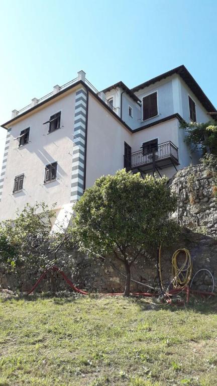 a large white building on top of a hill at Trekking in paradise B&B in Santa Margherita Ligure