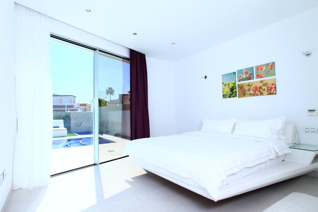 Postel nebo postele na pokoji v ubytování Villas Flamingo Resort
