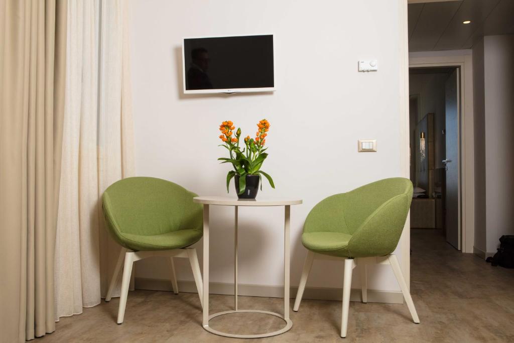 TV in/ali zabaviščno središče v nastanitvi Hotel Vittorio