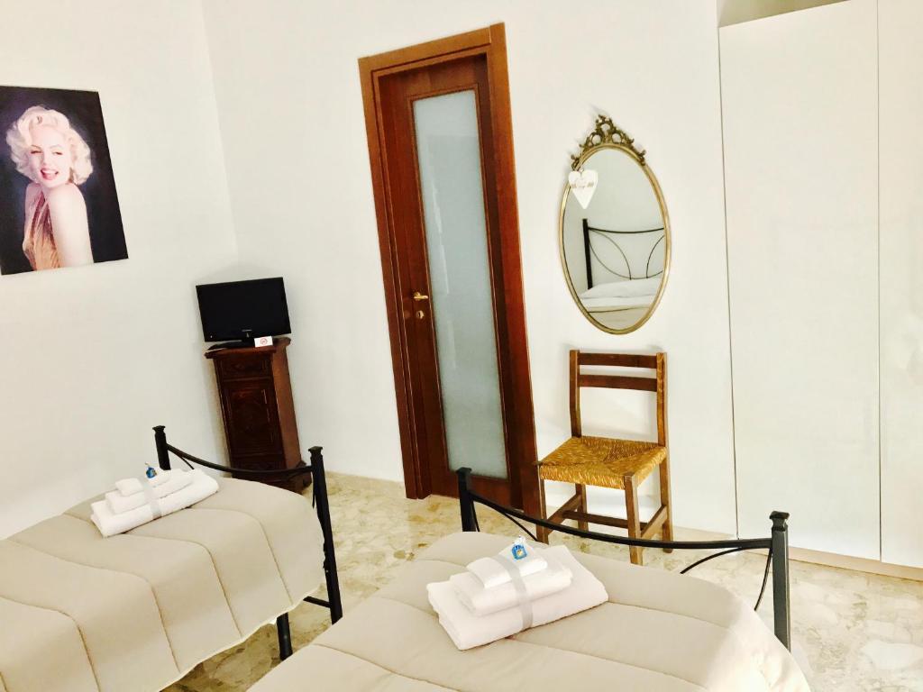 Postel nebo postele na pokoji v ubytování B&B Lo Scrigno