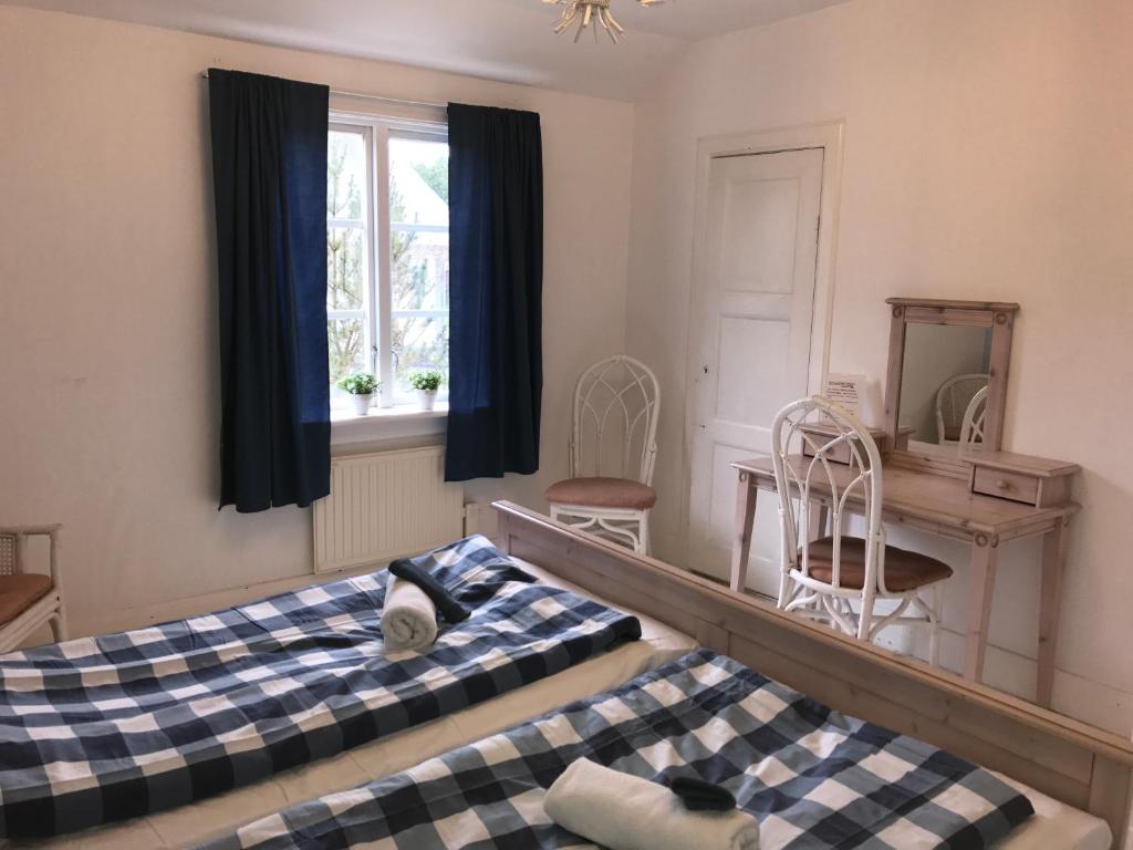 Postel nebo postele na pokoji v ubytování Hallandsgården by Mellbystrands