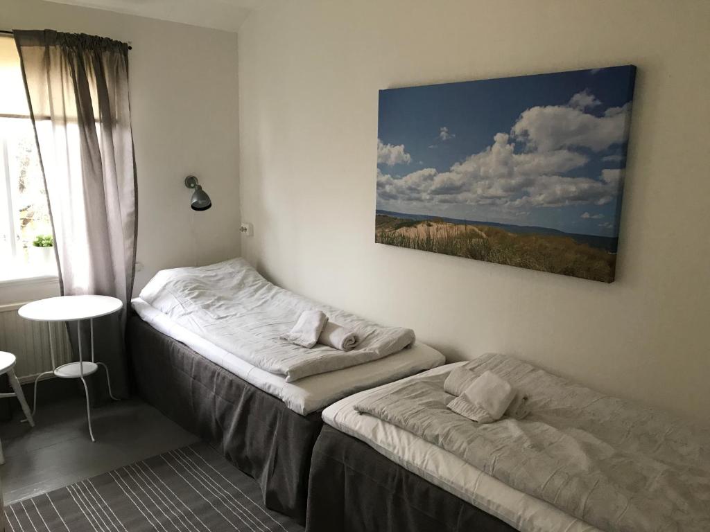 Postel nebo postele na pokoji v ubytování Hallandsgården by Mellbystrands