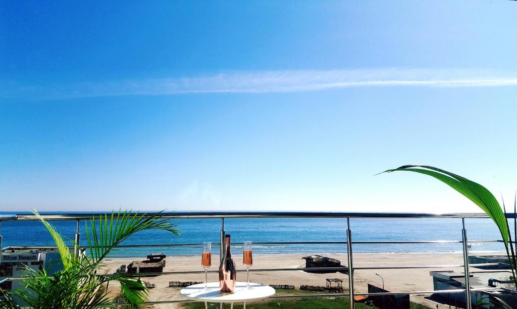 a view of the beach from the balcony of a resort at Summerland Sea View in Mamaia