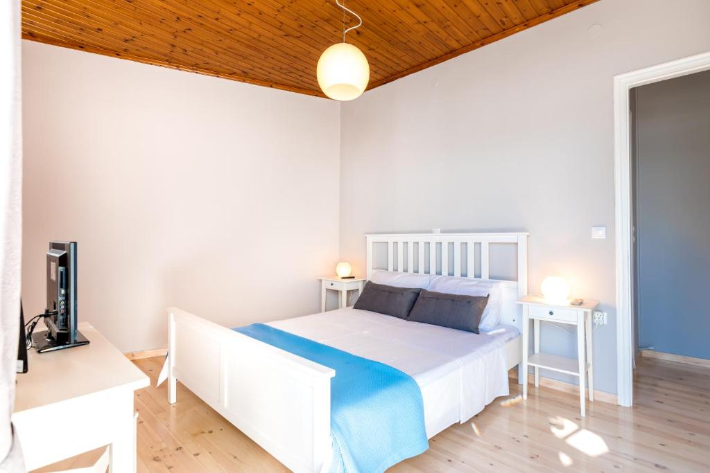 Postel nebo postele na pokoji v ubytování Tsonas Apartments
