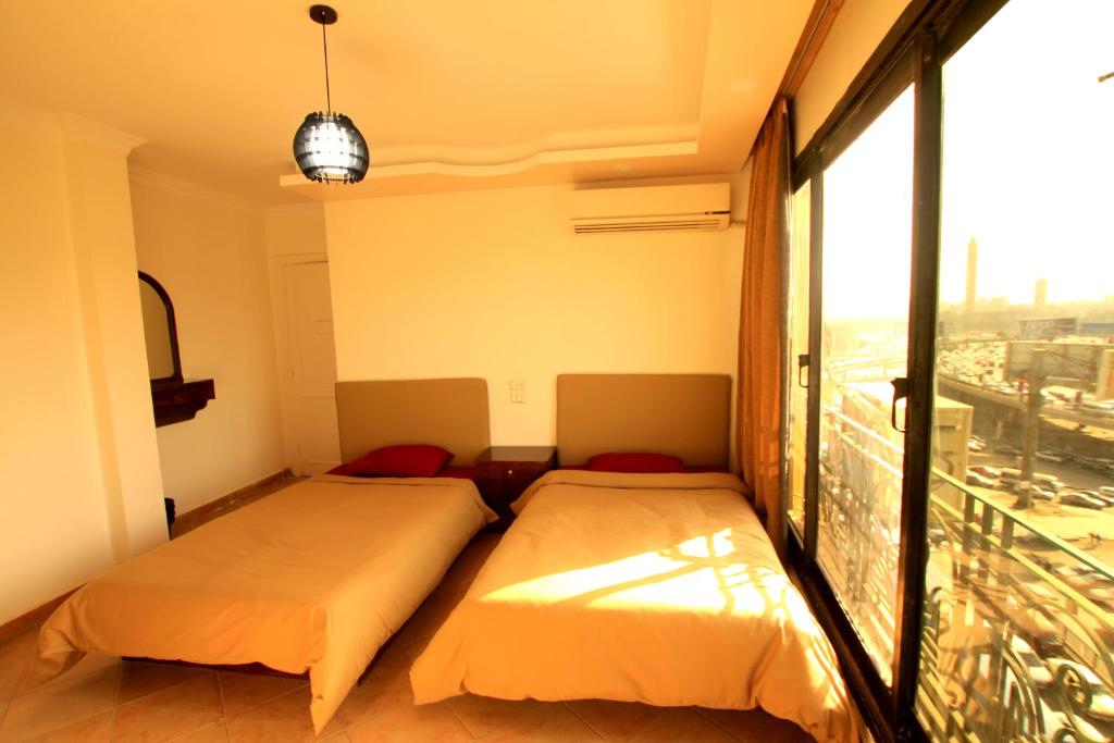 Postel nebo postele na pokoji v ubytování Arabesque Hotel