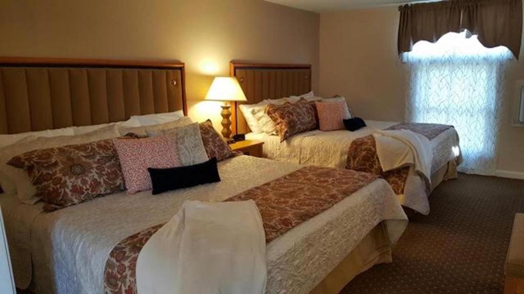 Postel nebo postele na pokoji v ubytování Starlight Lodge Cape Cod