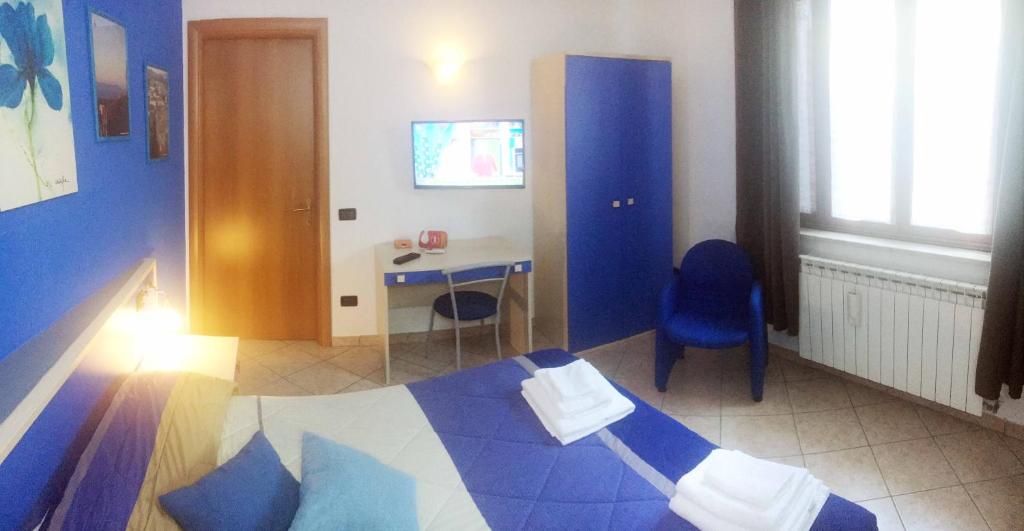 Łóżko lub łóżka w pokoju w obiekcie B&B Villa Giglio
