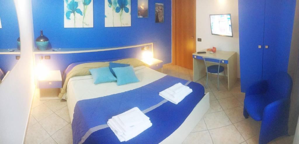 Łóżko lub łóżka w pokoju w obiekcie B&B Villa Giglio