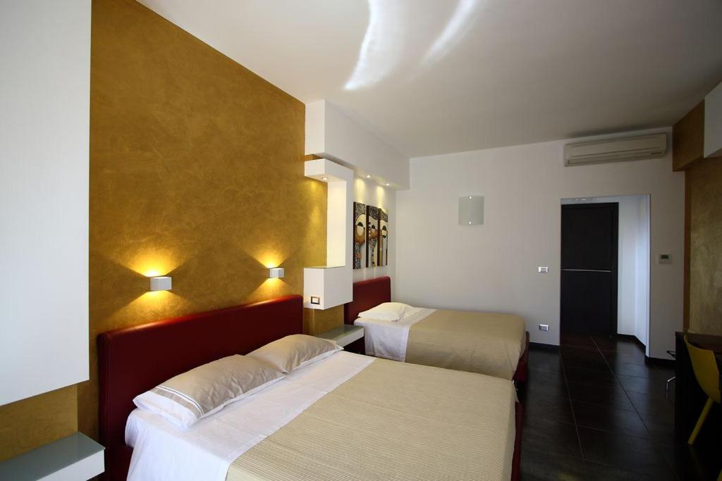 Postel nebo postele na pokoji v ubytování B&B Imbriani 24