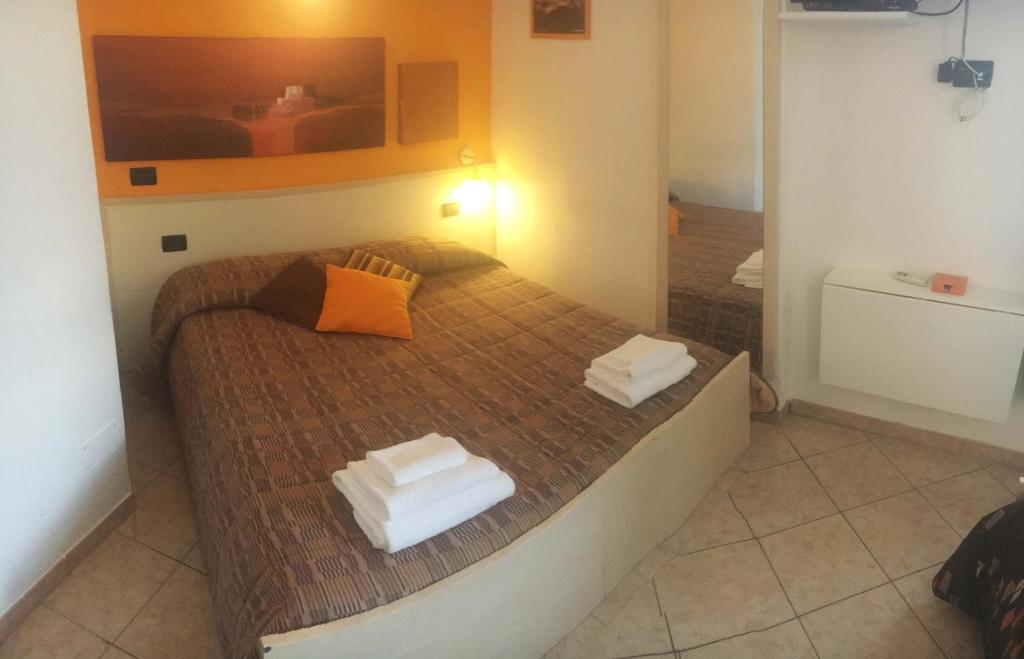 Łóżko lub łóżka w pokoju w obiekcie B&B Villa Giglio