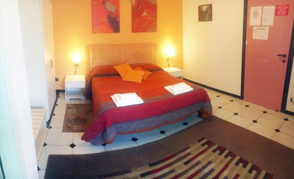 a bedroom with a large orange bed in a room at B&B Villa Giglio in Catanzaro