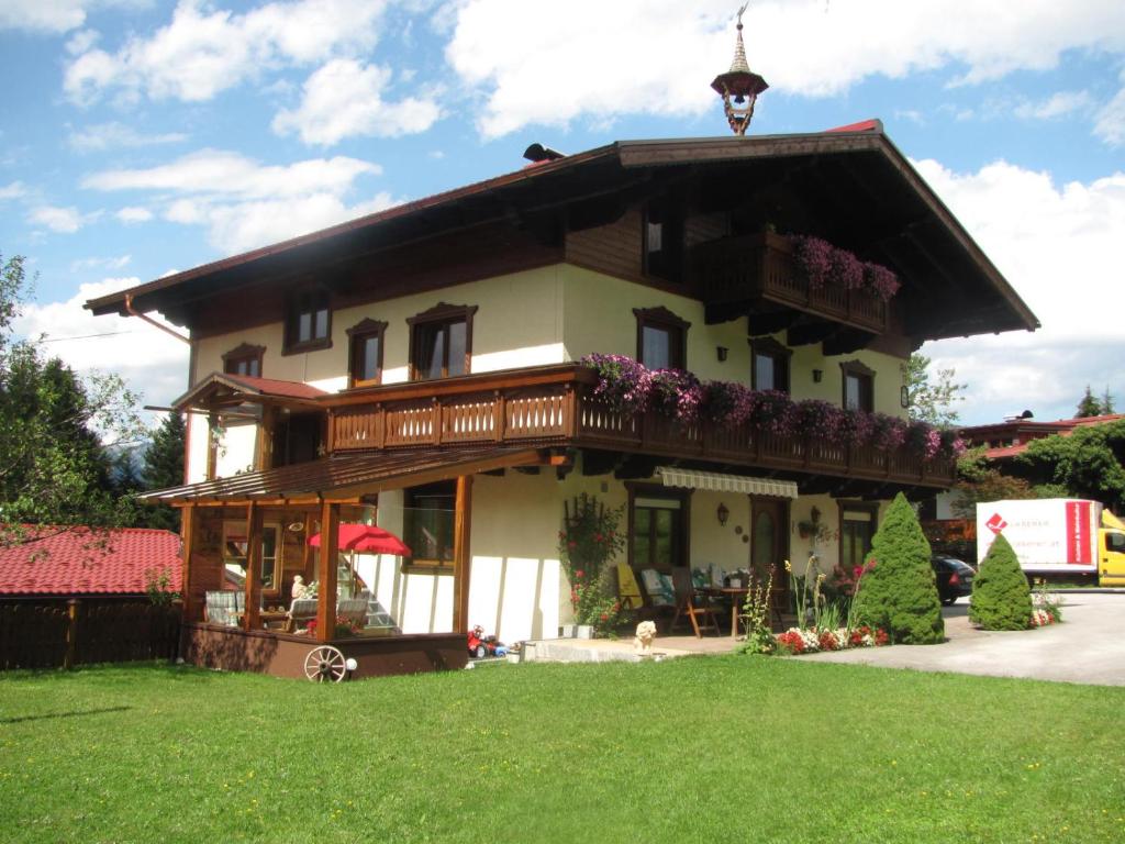 a large house with a balcony on top of it at Haus Maria Wallinger in Abtenau