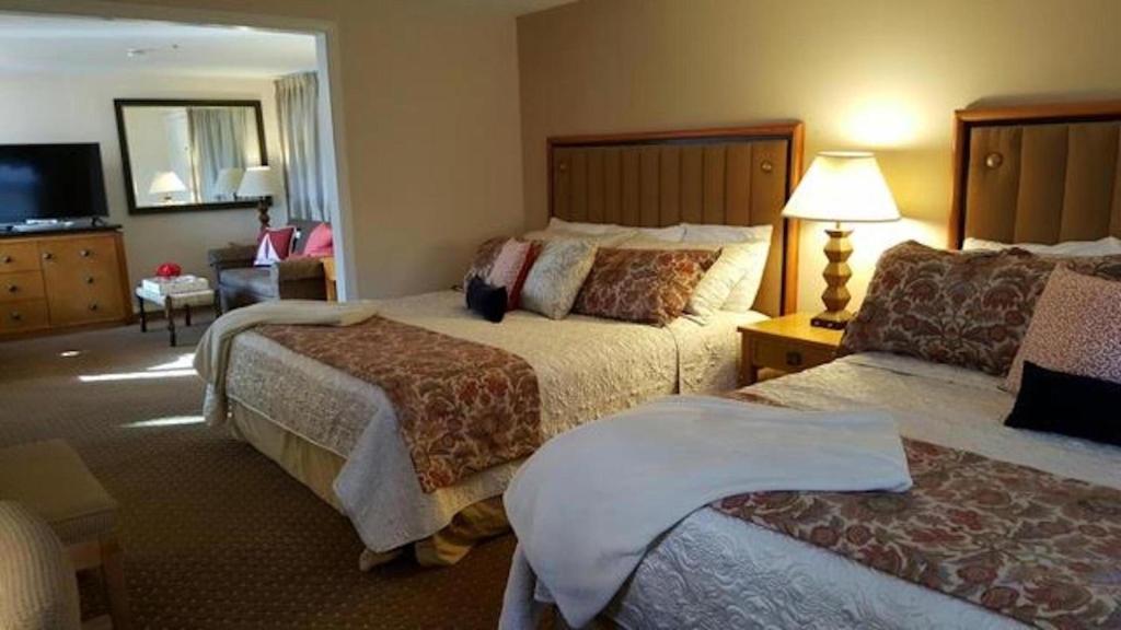 Postel nebo postele na pokoji v ubytování Starlight Lodge Cape Cod