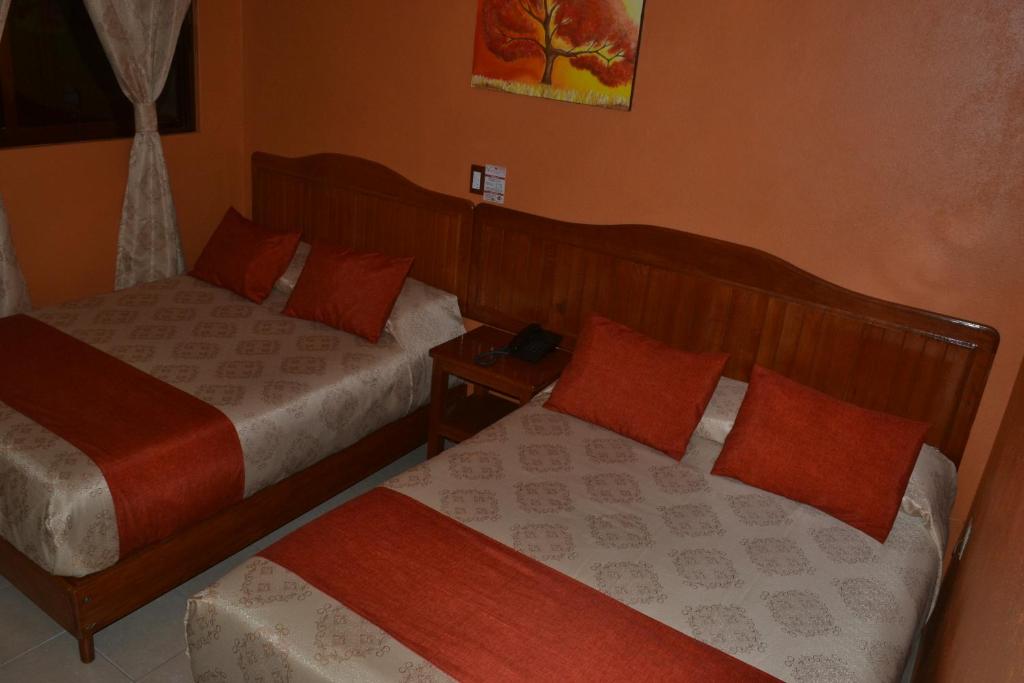 Postel nebo postele na pokoji v ubytování Hotel Márquez