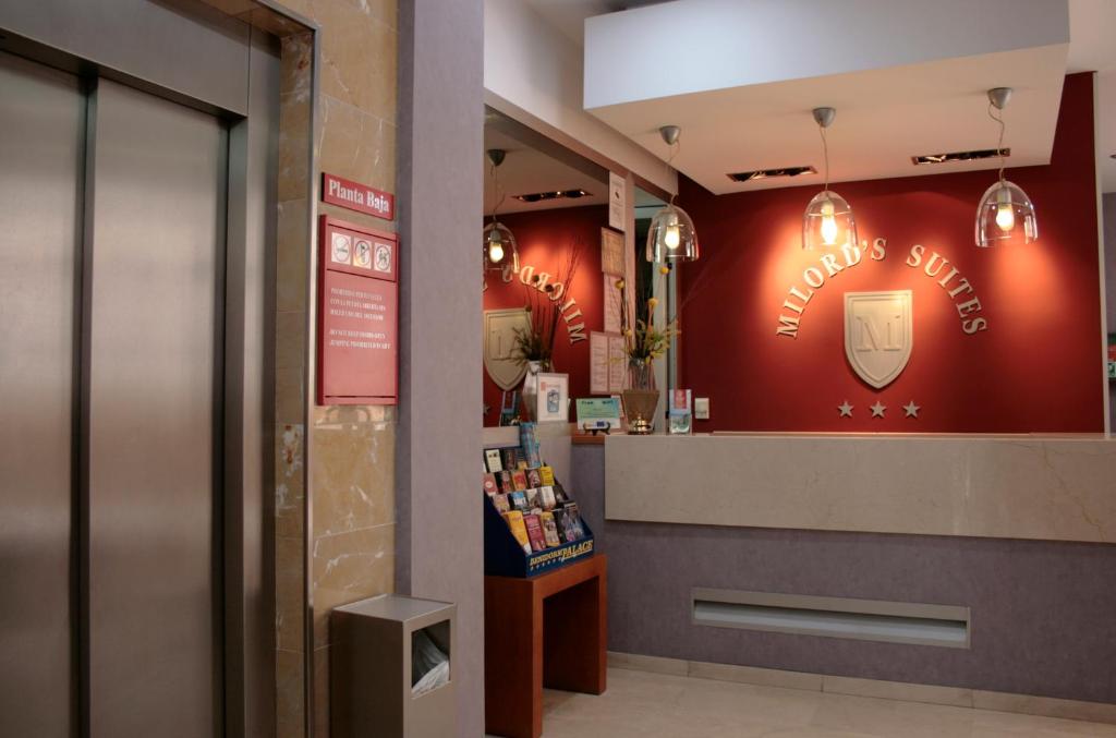 a store with a drink sign on the wall at Aparthotel Milord's Suites in Benidorm