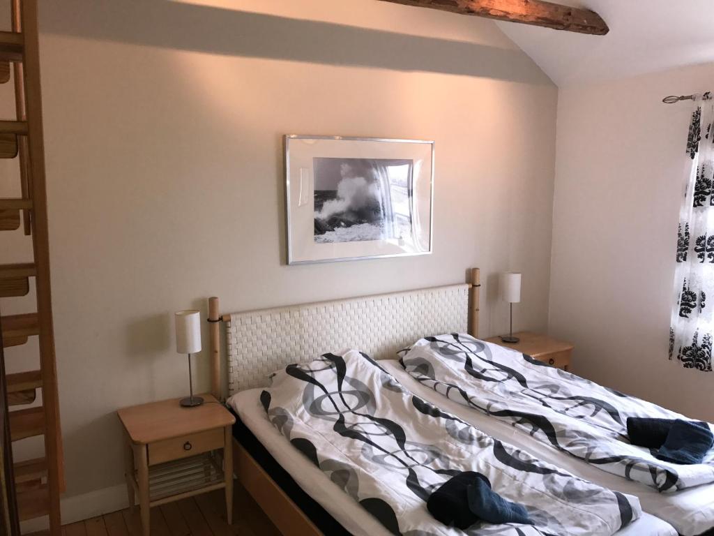 Postel nebo postele na pokoji v ubytování Hallandsgården by Mellbystrands