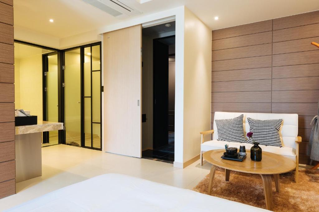 Postel nebo postele na pokoji v ubytování Boutique Hotel XYM Pyeongtaek