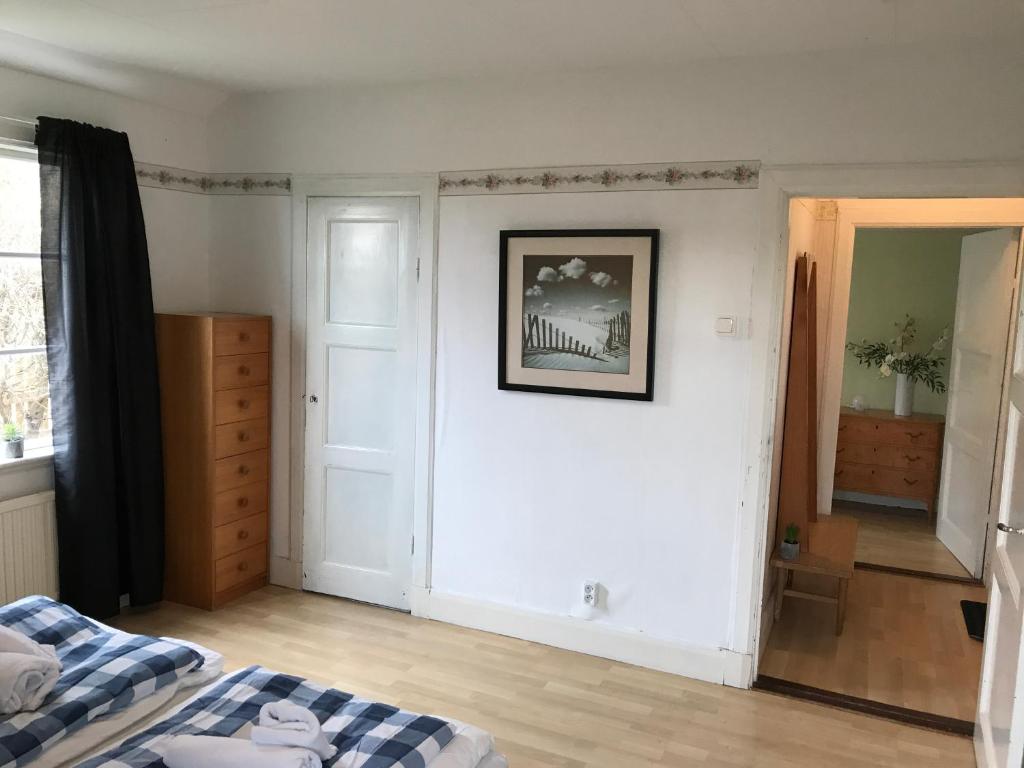 Postel nebo postele na pokoji v ubytování Hallandsgården by Mellbystrands
